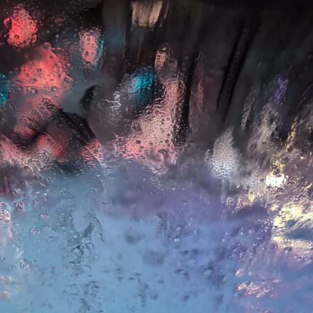 Cover art for Toxic residue: city lights refracted through a rain-covered window